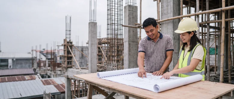 Owner and engineer reviewing plans on site
